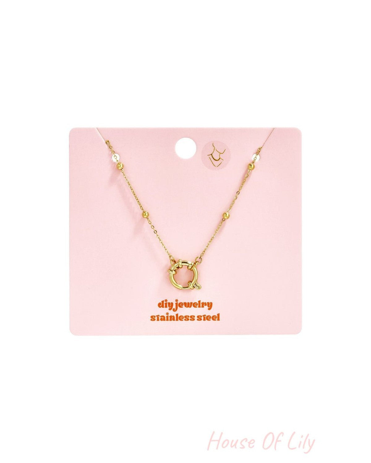 Dainty gold stainless steel necklace with a delicate chain, bead accents, and a circular spring-ring clasp.