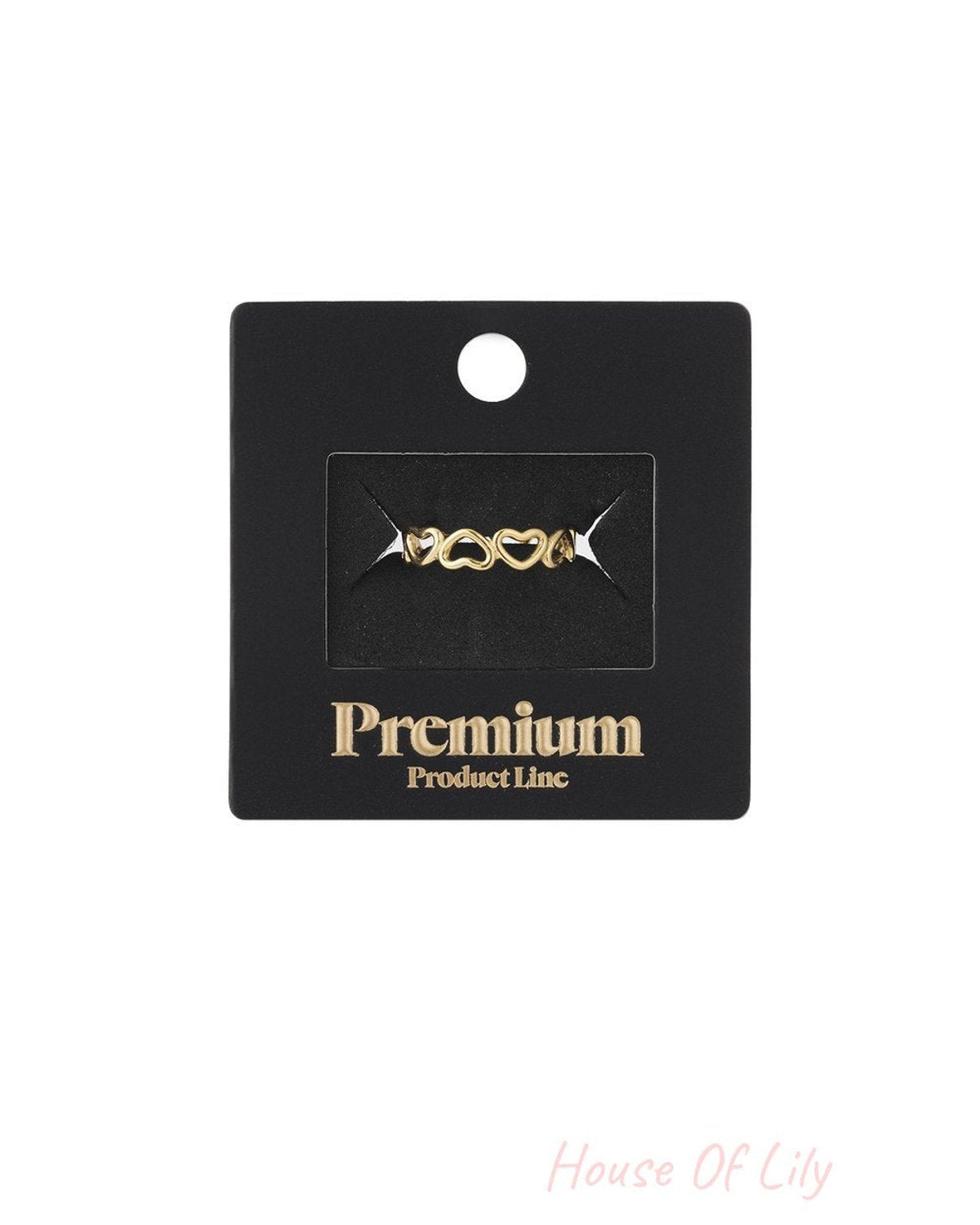 Golden Heart Era gold-tone ring featuring a delicate band of interconnected cutout heart shapes on a black display card.