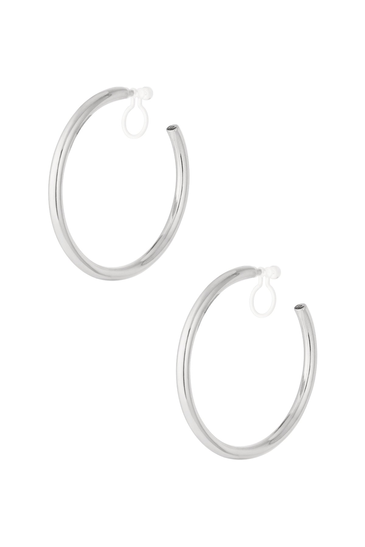 Pair of classic minimal silver clip-on hoop earrings isolated on white background