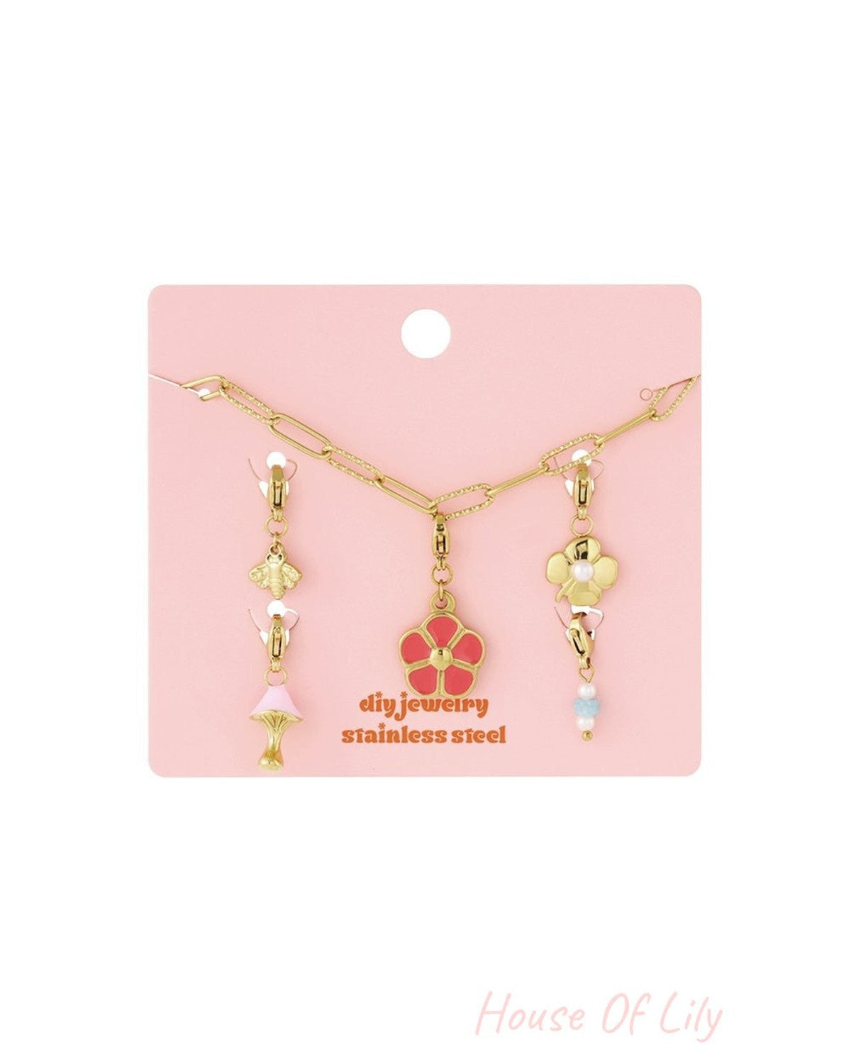 Main Character Petals: Gold-tone stainless steel chain bracelet featuring charms of a pink flower, bee, and mushroom.