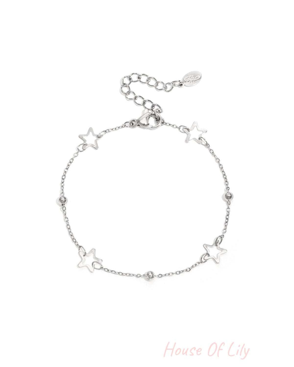 Silver star chain bracelet with hollow star charms and polished beads on white background