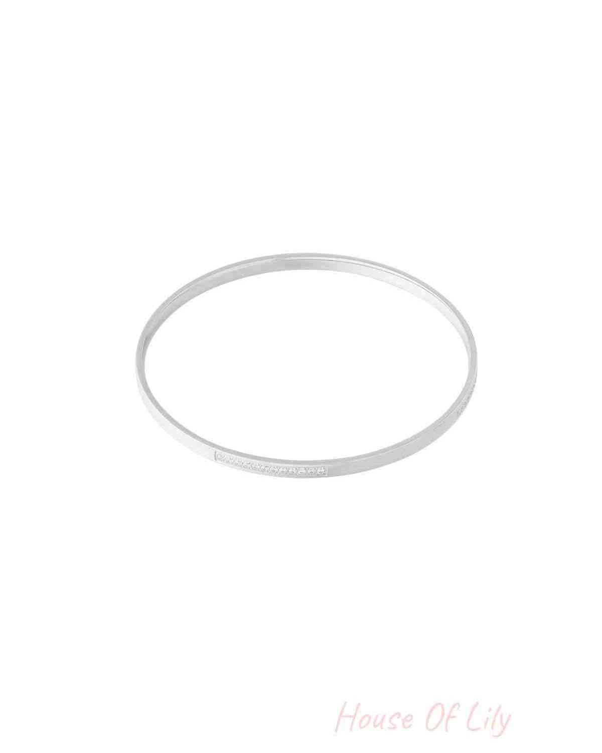 Silver thin rhinestone bangle bracelet isolated on white background