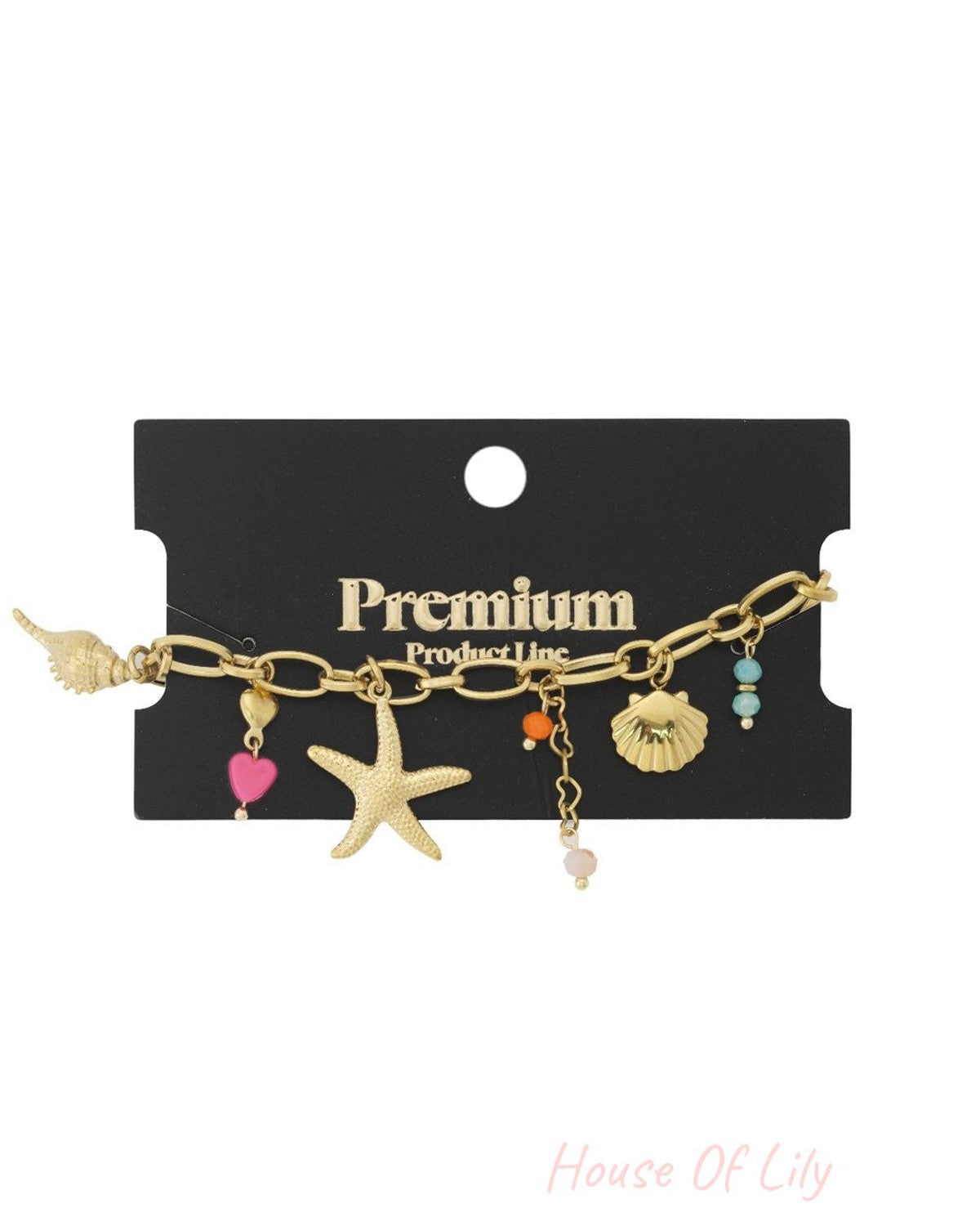 Gold chain bracelet with nautical charms: starfish, seashells, colorful beads, and a pink heart on a black display card.