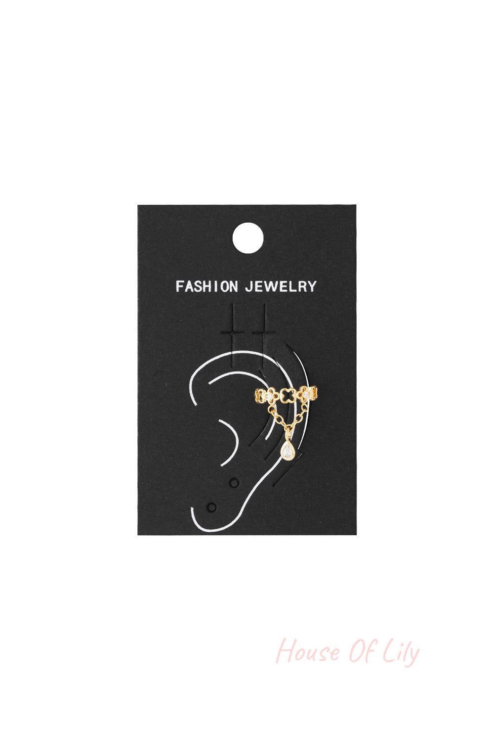 Gold Zesty geometric ear cuff with clover-shaped links, delicate chain, and a dangling pear-cut crystal pendant.