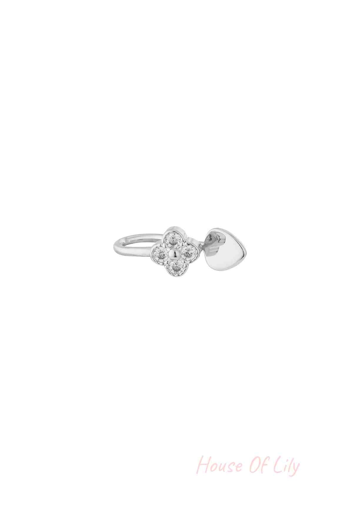 Silver tone nose cuff with zircon clover cluster and smooth heart accent isolated on white background