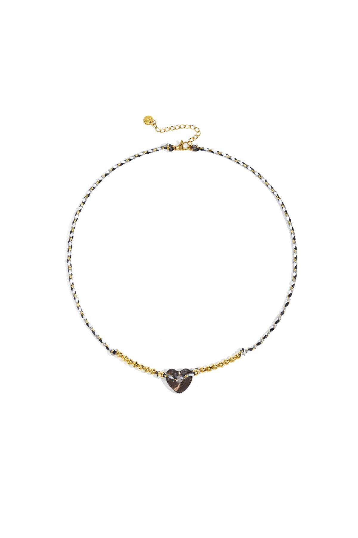 Black and white braided necklace with smoky translucent heart bead and gold-tone beads on white background