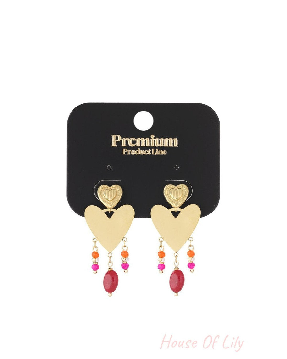 Gold-tone heart drop earrings with dangling colorful beads in pink, orange, and red on a branded black display card.