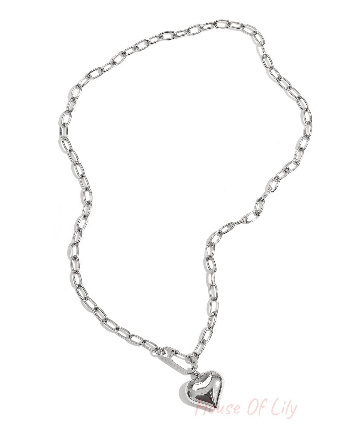 Silver chunky chain necklace with puff heart pendant displayed flat on white background