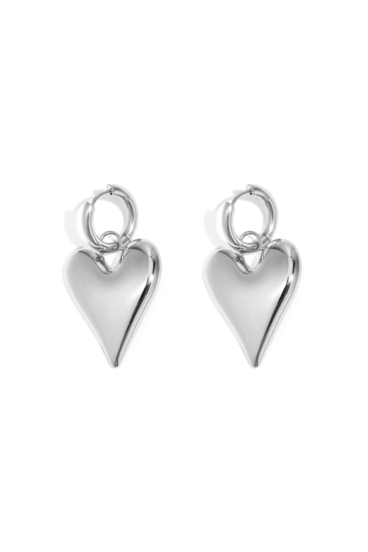 Pair of shiny silver chubby heart-shaped hoop earrings on white background