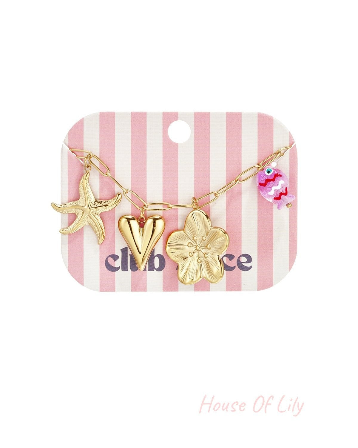 Gold charm bracelet with beach-themed charms displayed on pink and white striped branded card