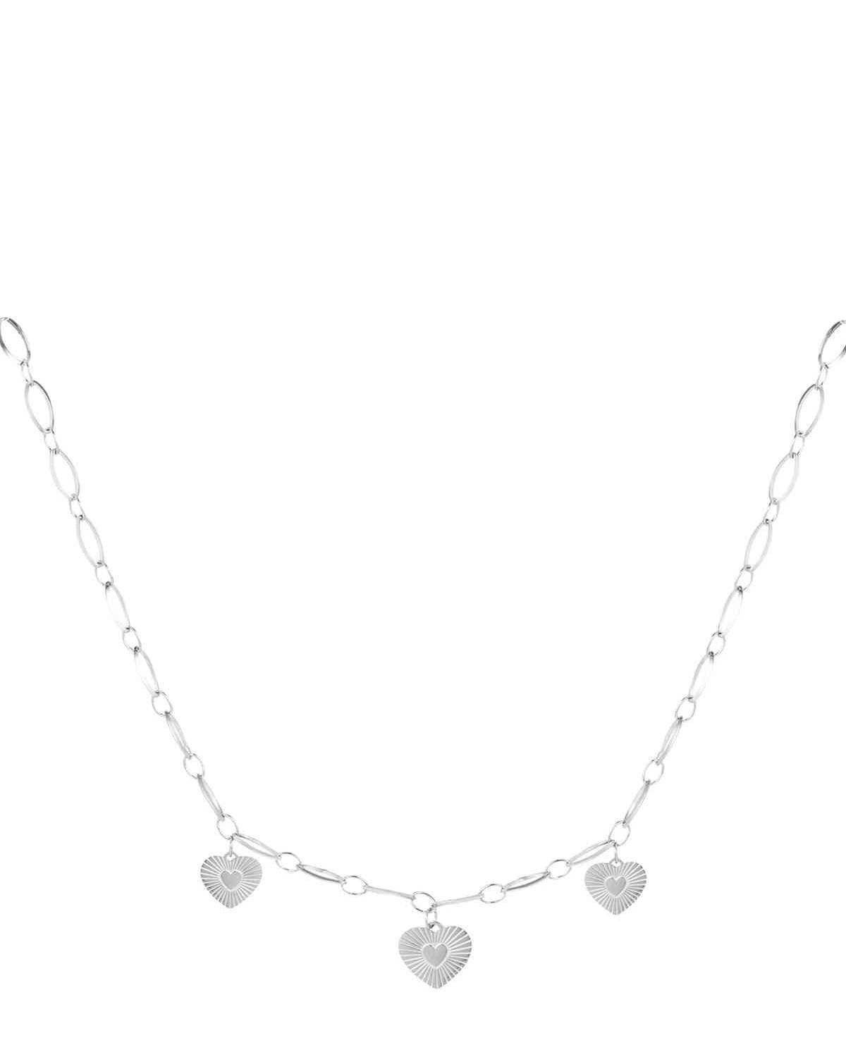 Silver version of triple heart charm necklace displayed on white background