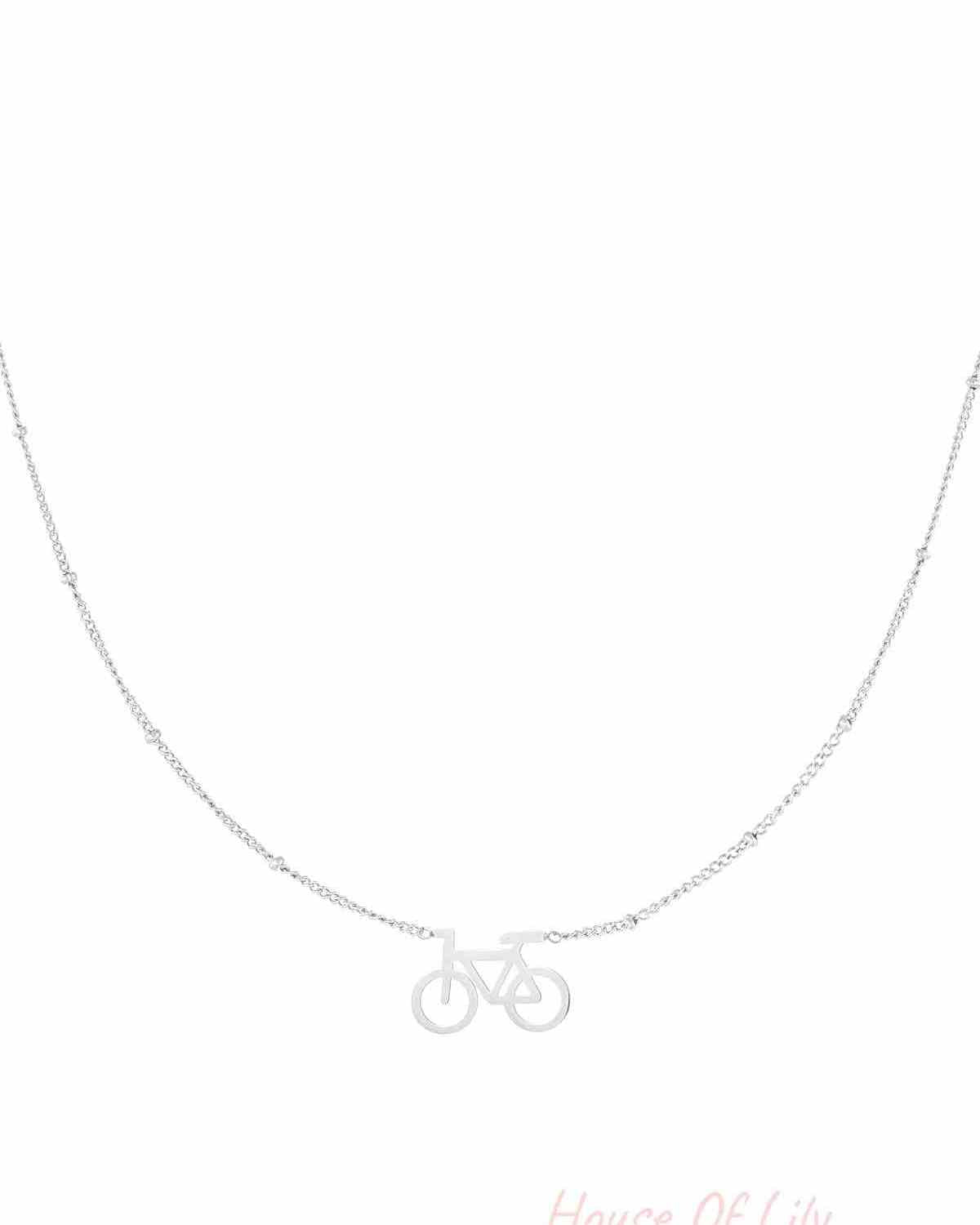 Silver cycle chic pendant necklace with delicate beaded chain on white background