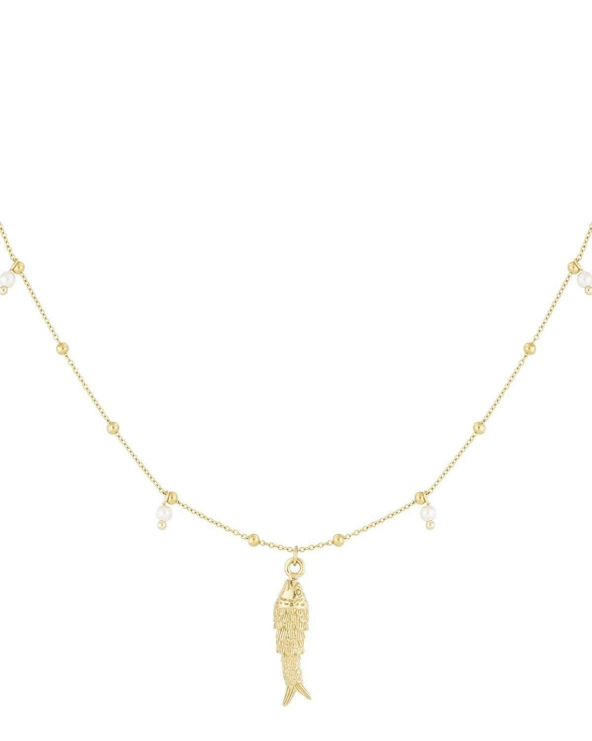 Gold-toned fish charm necklace with pearl bead accents on white background