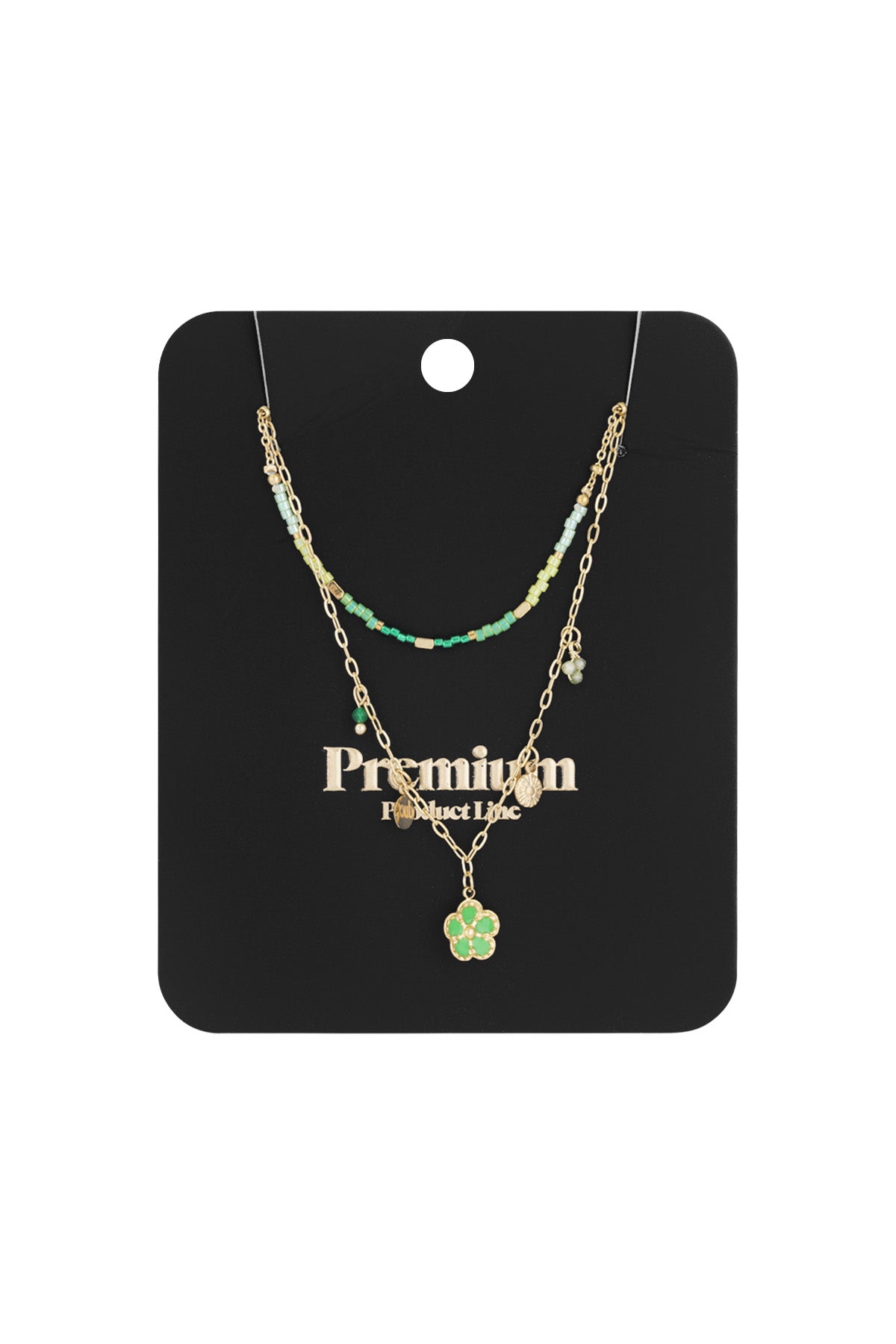 Packaged double-layered necklace displayed against a black card with gold text, showing green beads and flower pendant