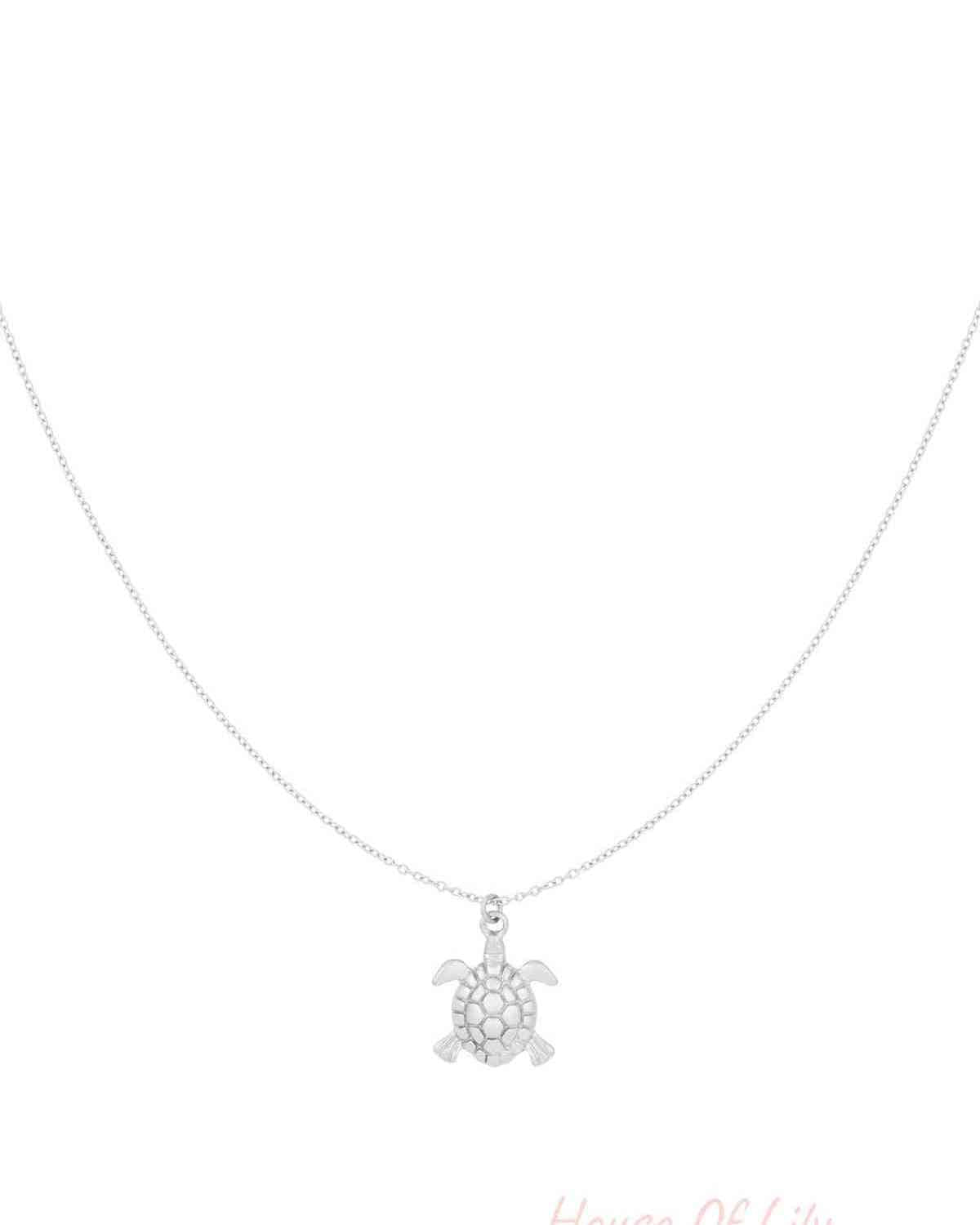 Silver turtle charm pendant necklace on a delicate chain displayed on white background