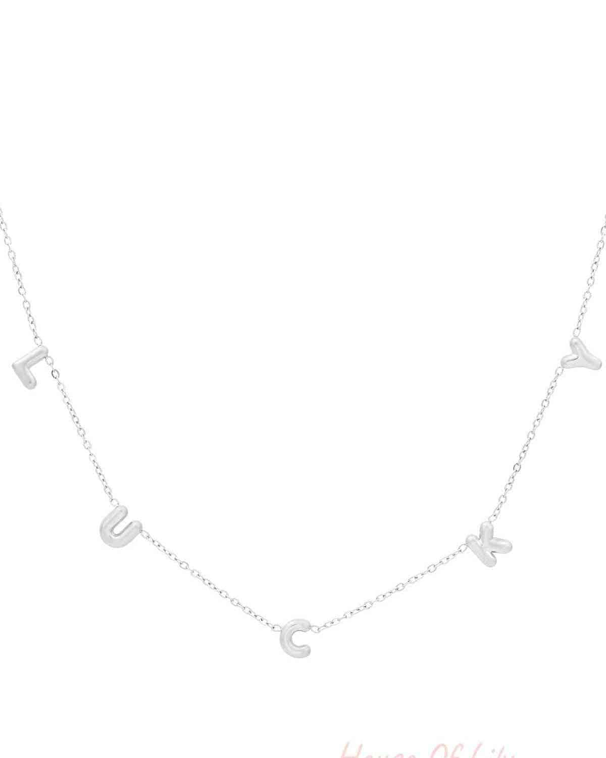 Silver letter pendant necklace spelling LUCKY on a white background