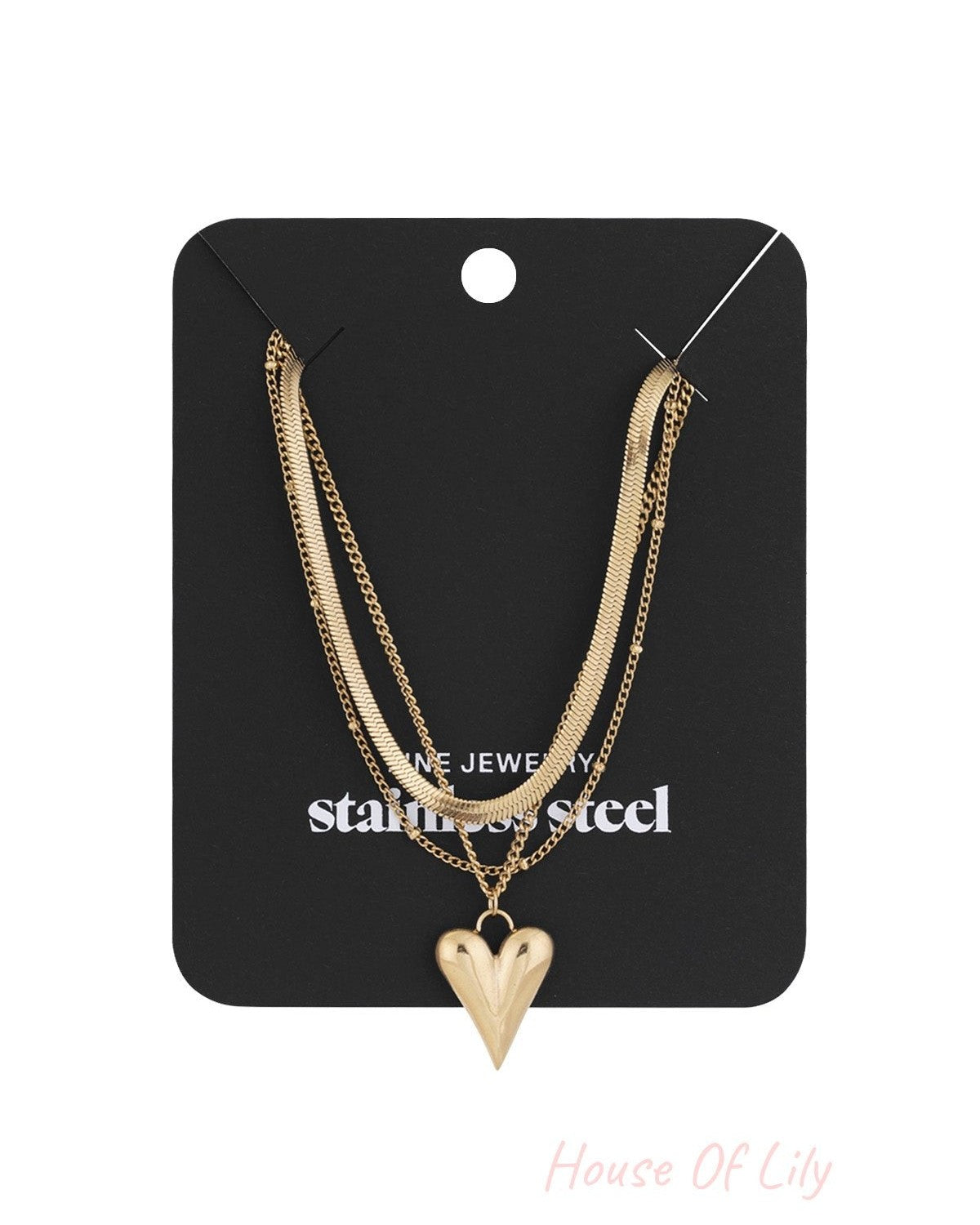 Gold heart layered necklace displayed on black jewelry card with stainless steel label