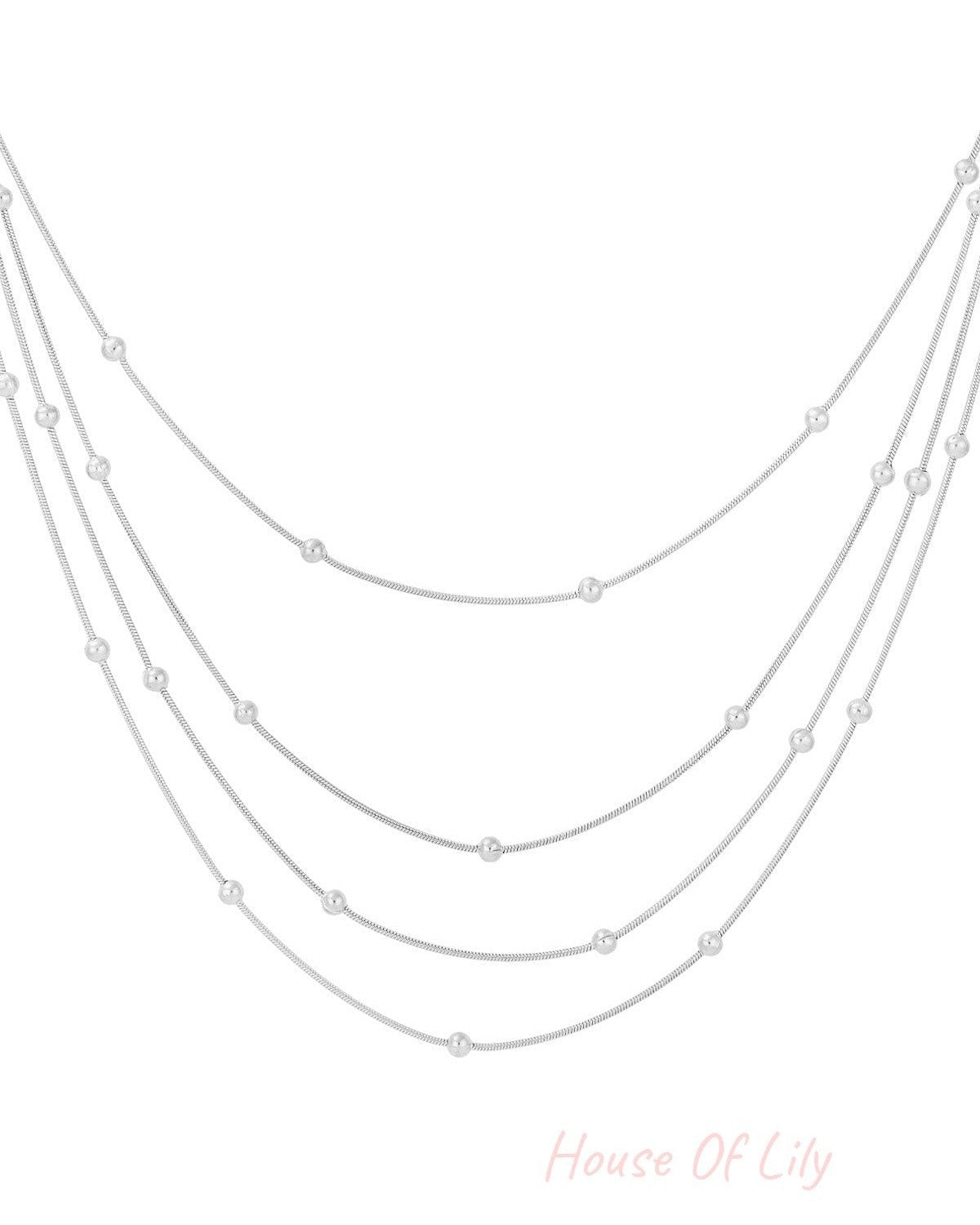 Silver layered beaded necklace isolated on white background
