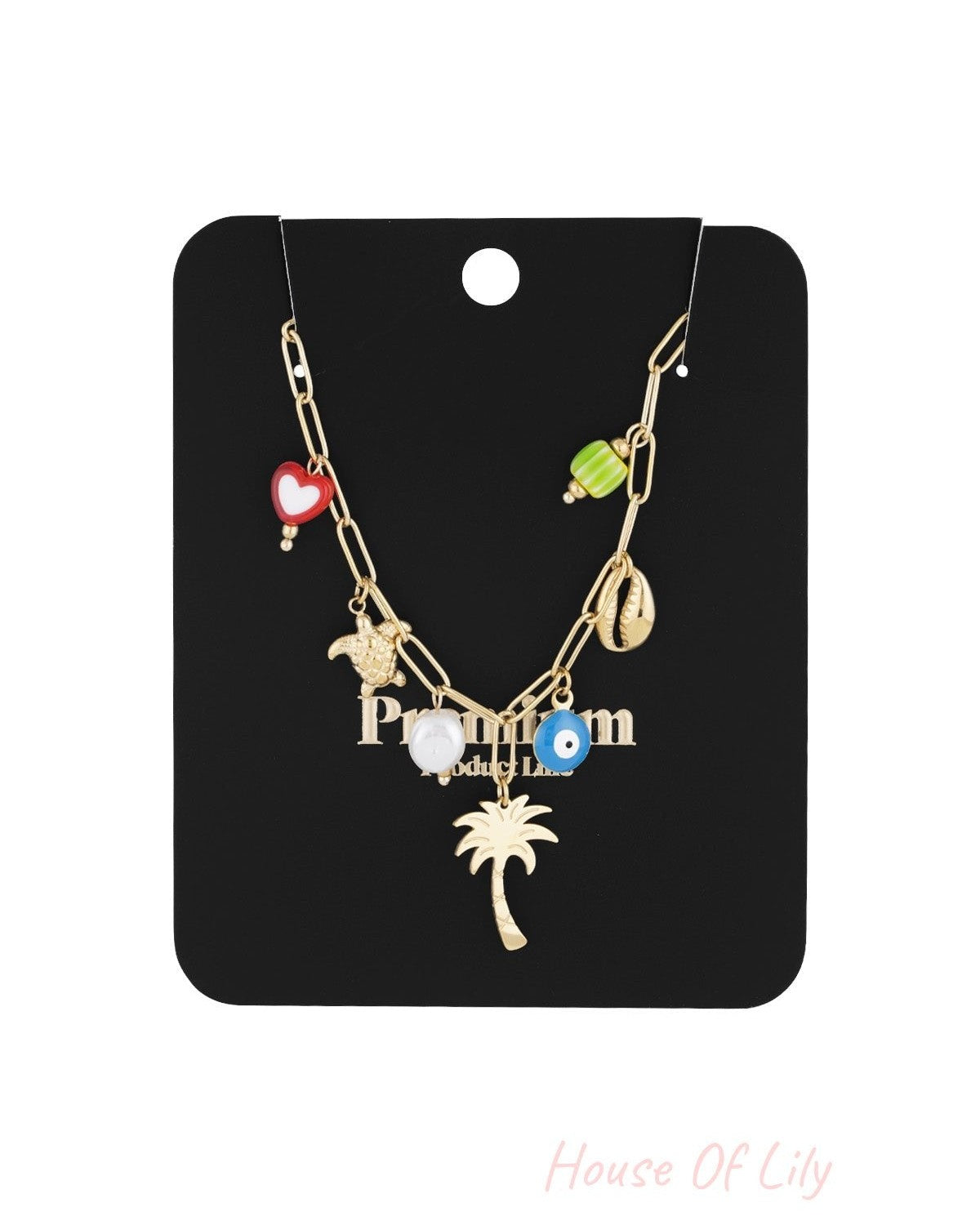 Gold-tone charm necklace displayed on a black product card highlighting each colourful charm in detail