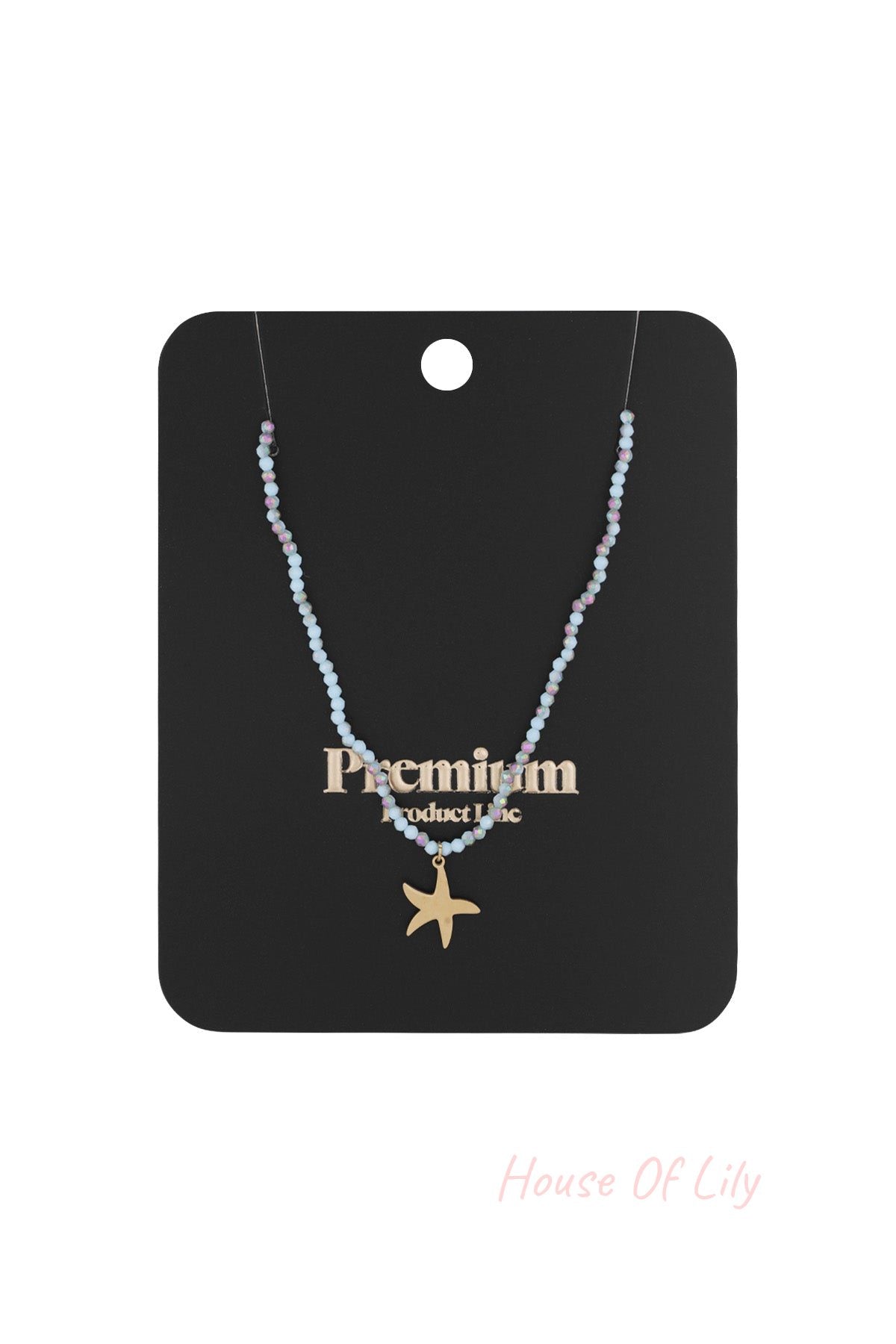 Beaded starfish charm necklace displayed on black premium product card packaging
