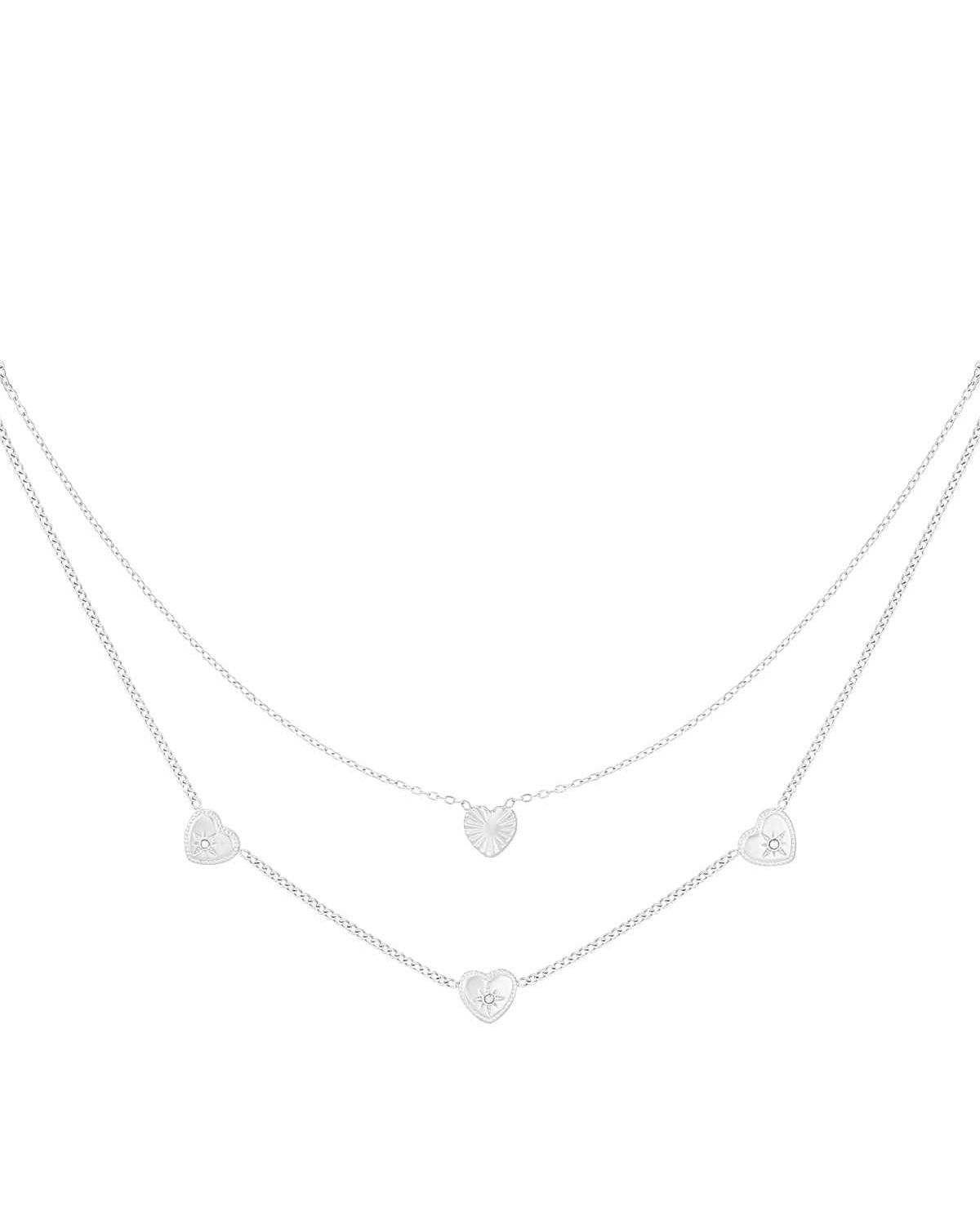 Silver-tone version of the double layered heart necklace with small rhinestone accents on white background
