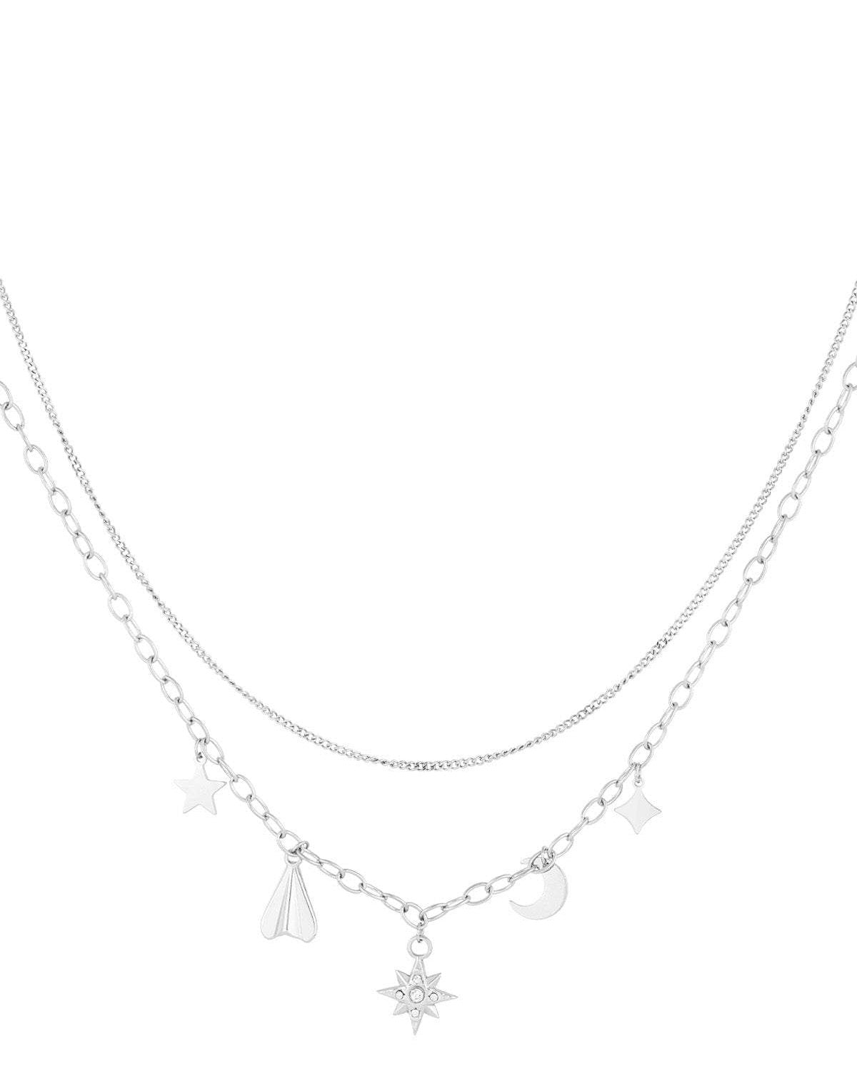 Silver layered necklace with celestial charms similar to the gold version on white background