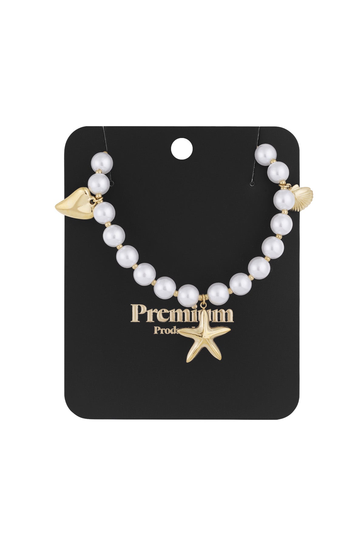 Pearl charm necklace displayed on black premium card with gold starfish, shell, and heart charms