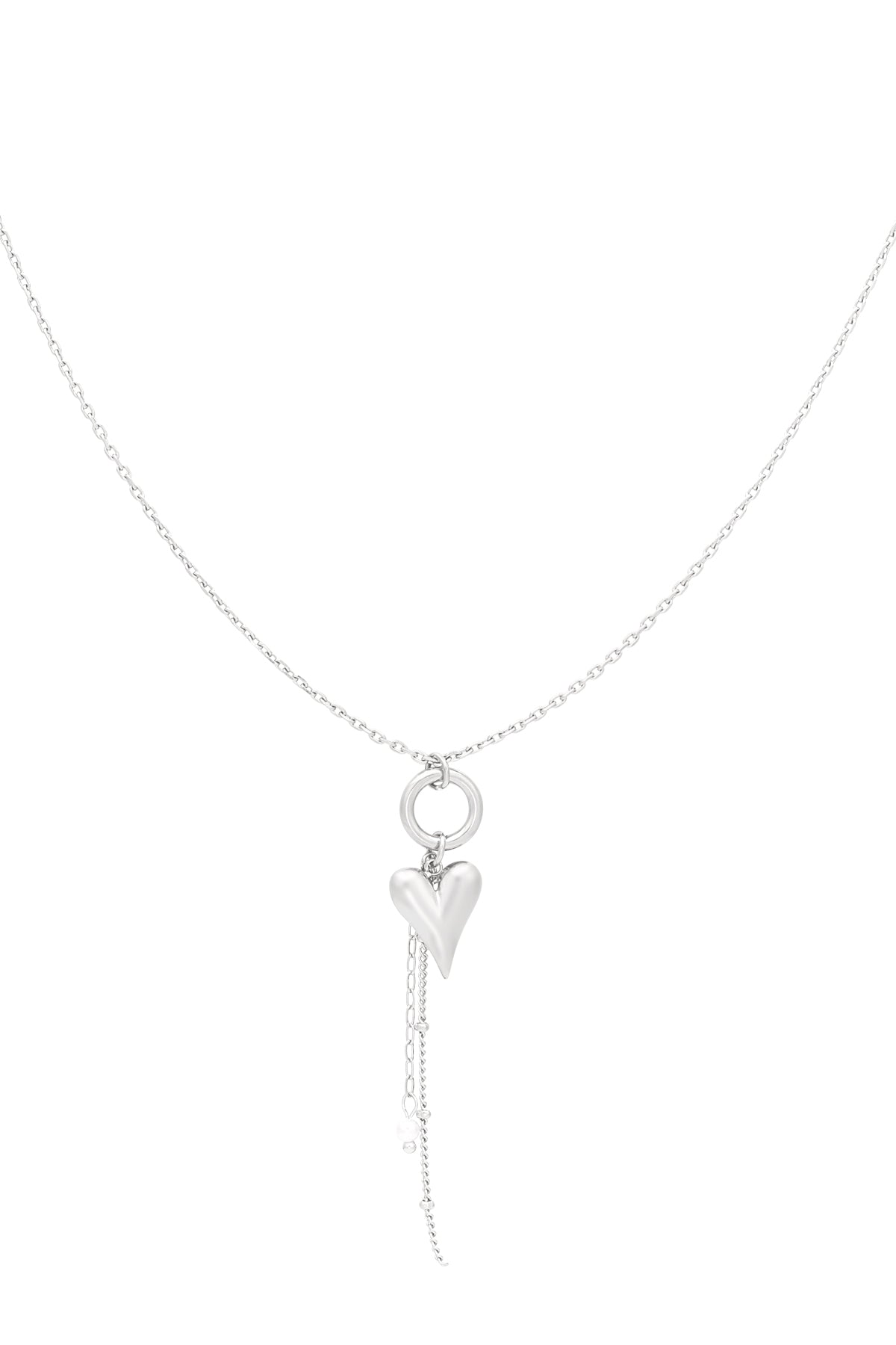 Silver heart charm pendant necklace with dangling chain and faux pearl detail on white background