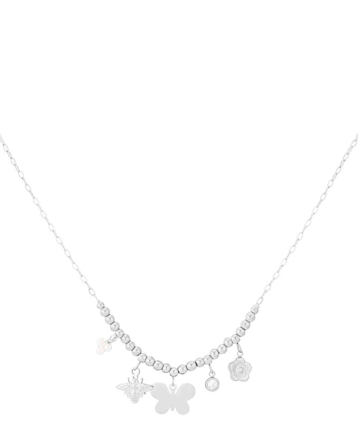 Silver charm beaded necklace with butterfly, bee, pearl and floral charms on white background