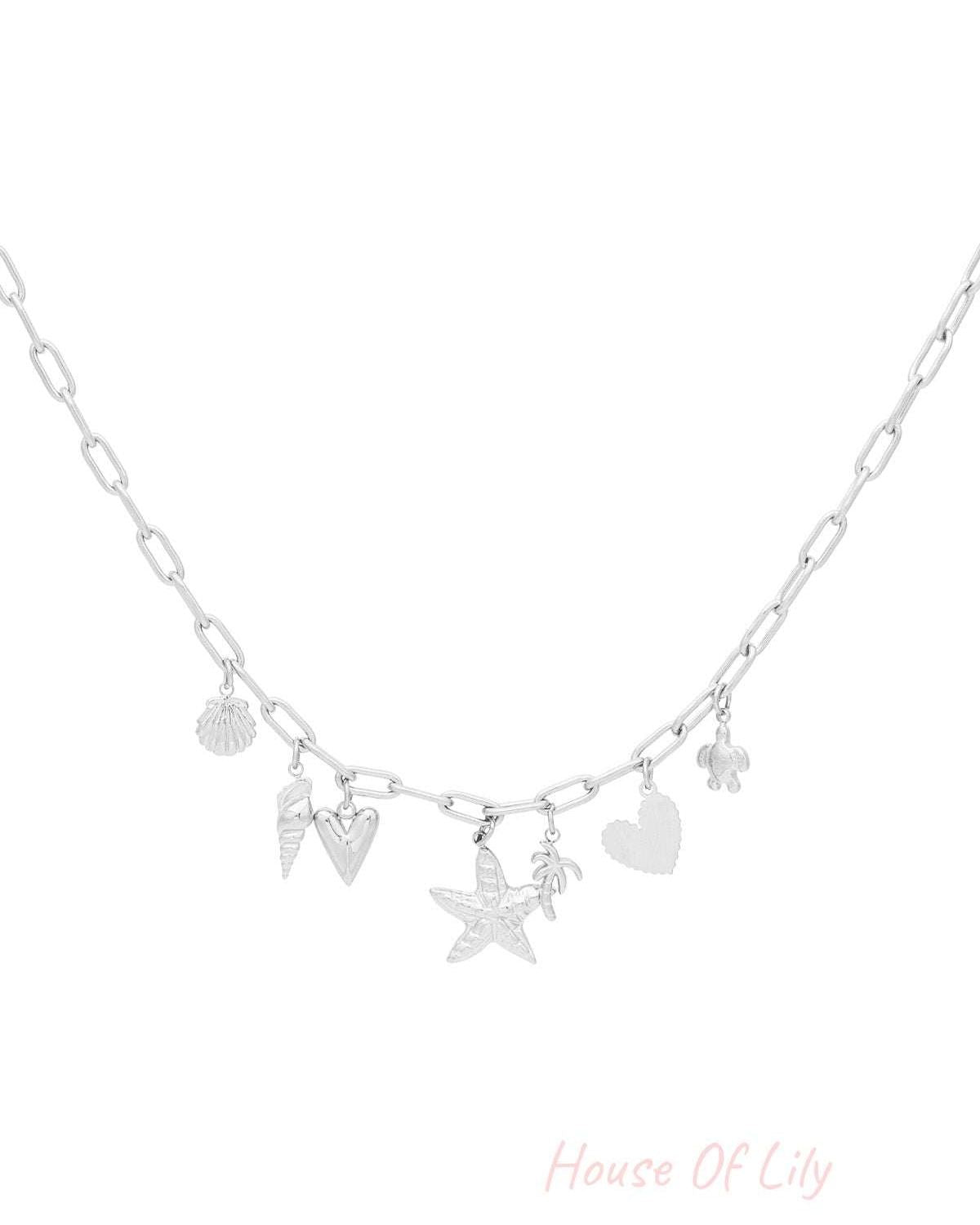 Silver version of the charm necklace featuring identical beach-themed charms on a silver chain