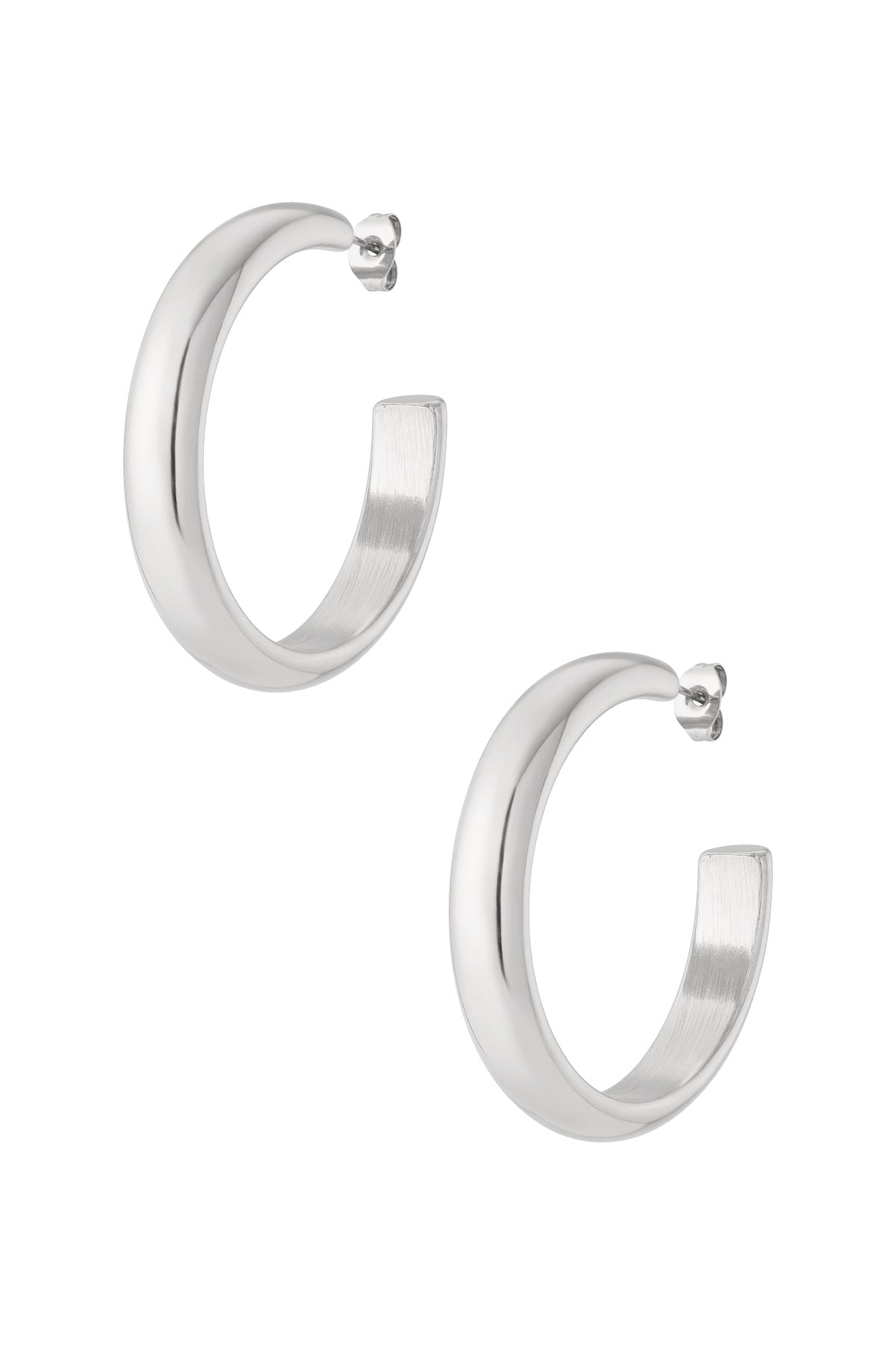 Pair of polished silver chunky hoop earrings featuring thick rounded hoops with post closure
