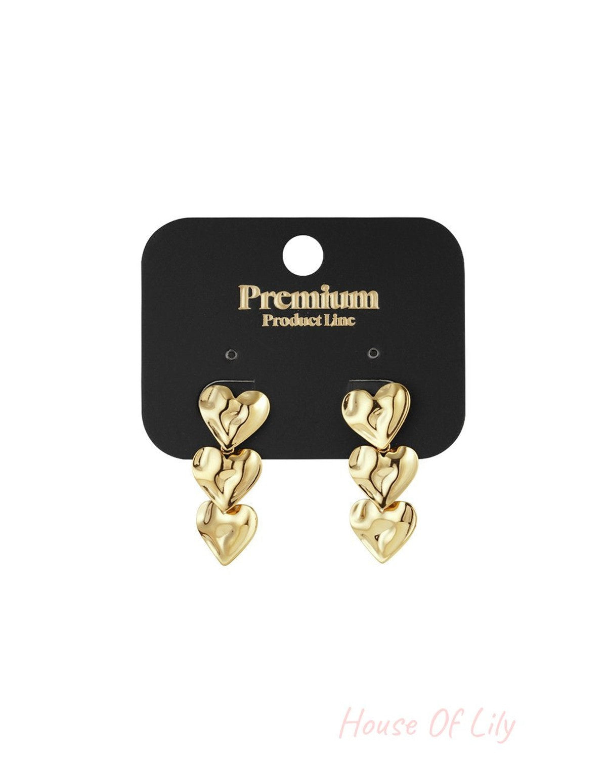 Brushed gold drop earrings featuring a trio of interconnected, organic-shaped hearts on a black display card.