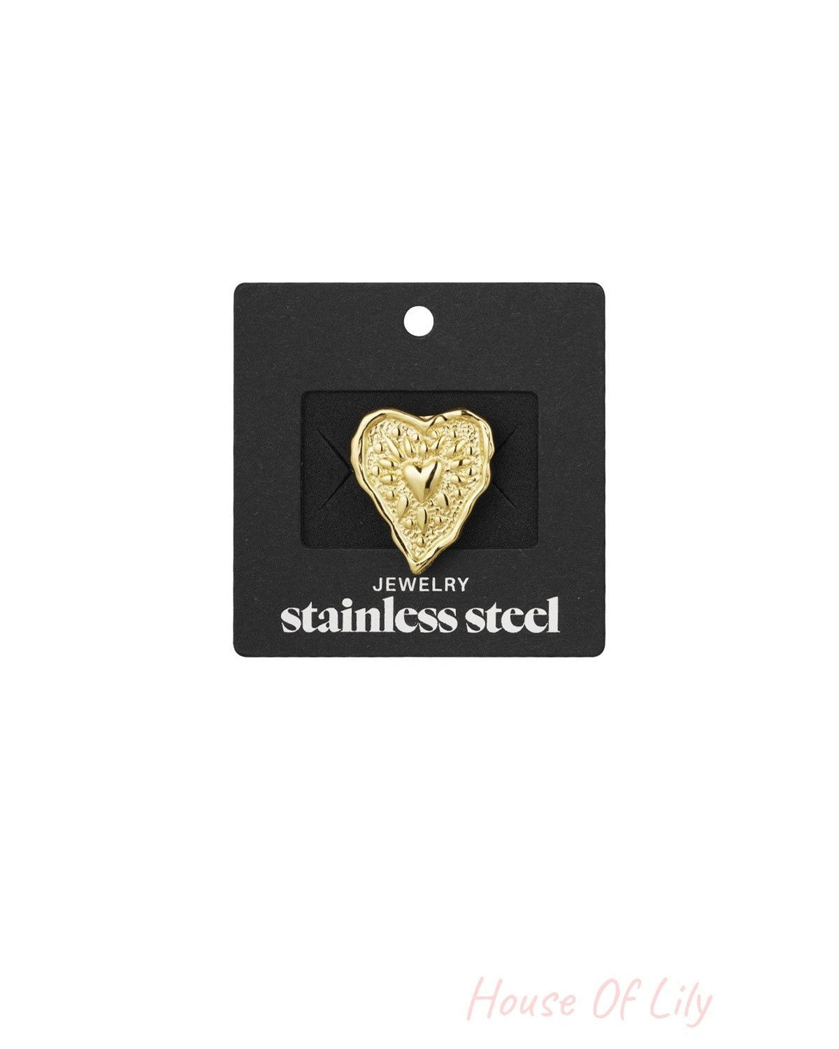 Gold wrinkled heart stainless steel ring displayed on black jewellery card with white text