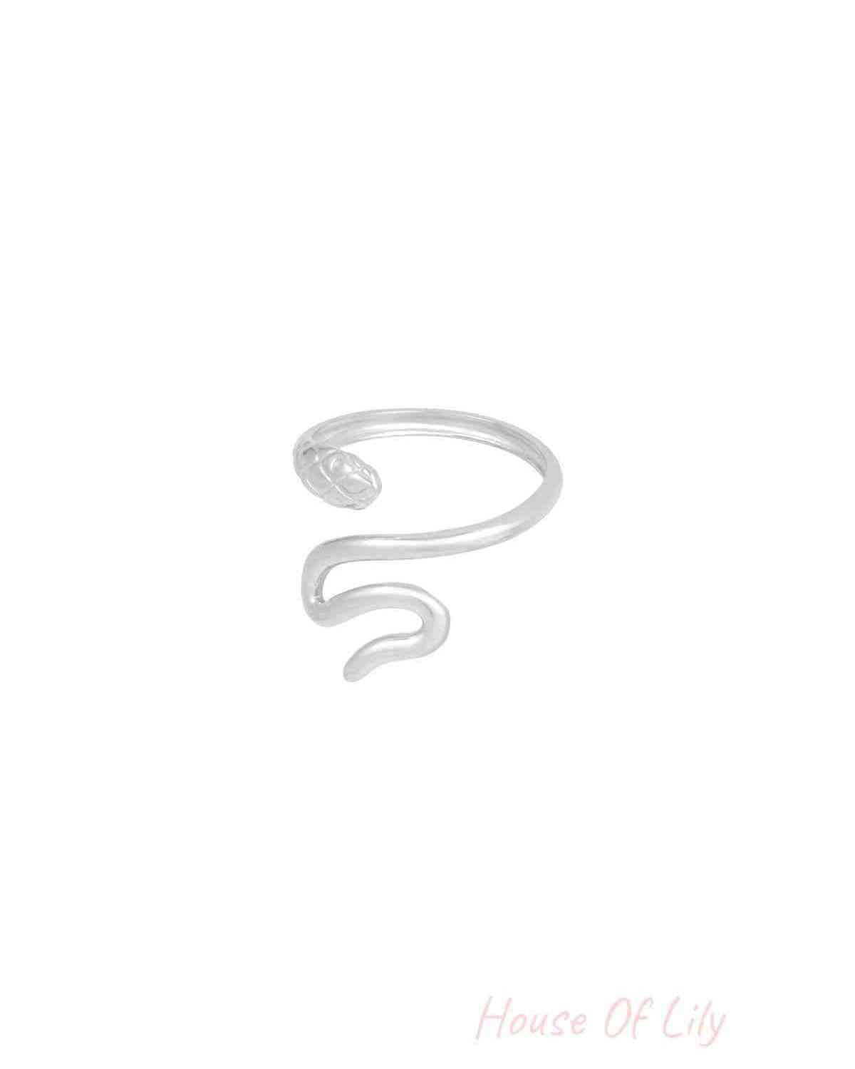 Alternative angle of silver snake ring showing smooth curves and textured snake head