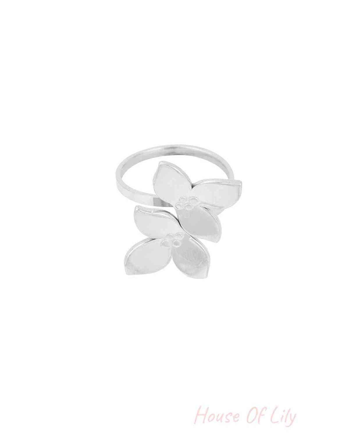 Silver double flower stainless steel ring on white background