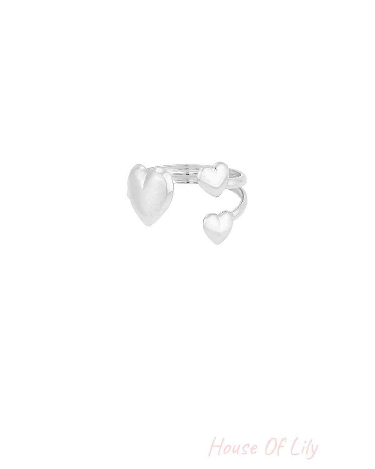 Silver-tone version of trio heart open ring showing three hearts and open adjustable band