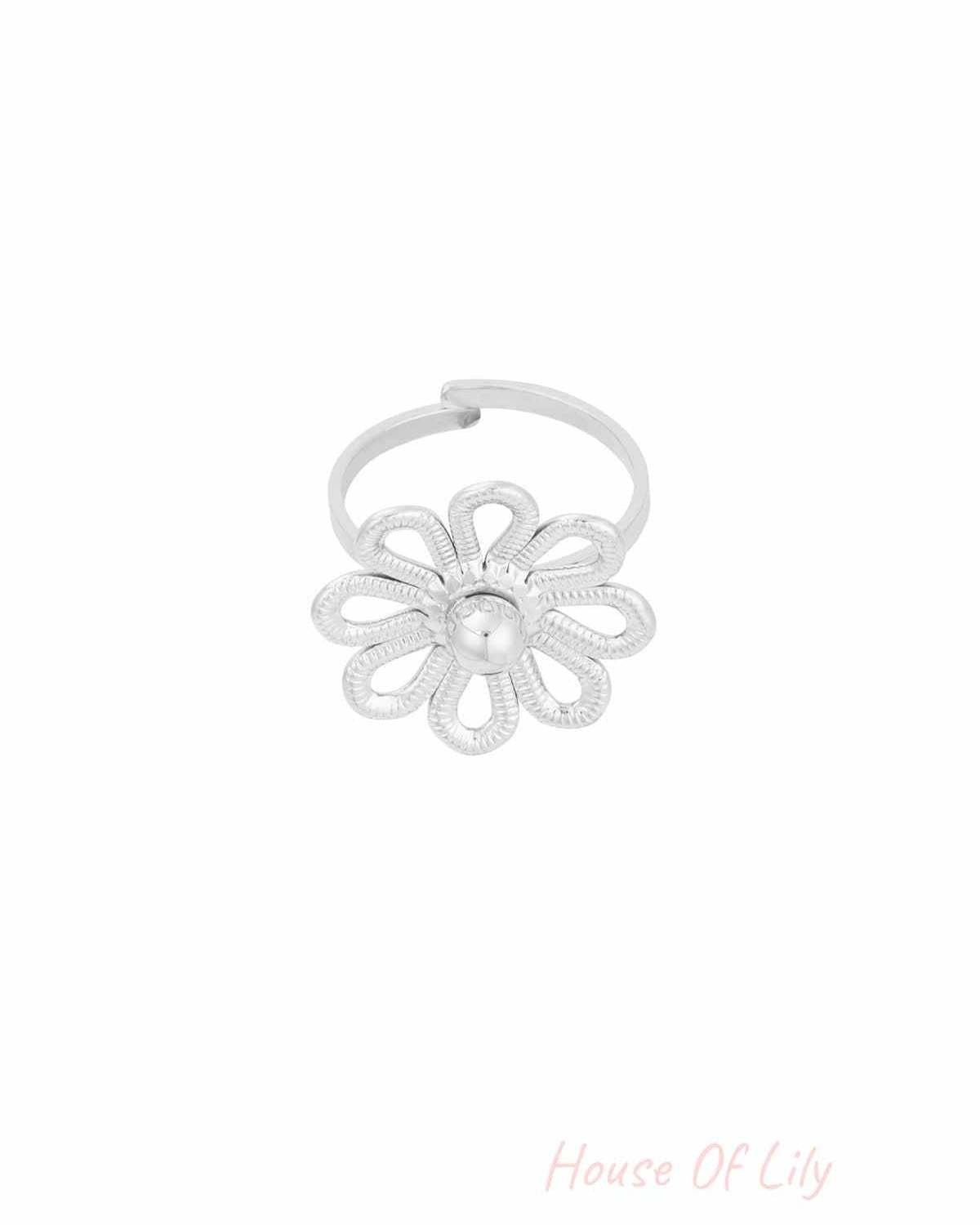 Silver flower statement ring variation with same design on white background