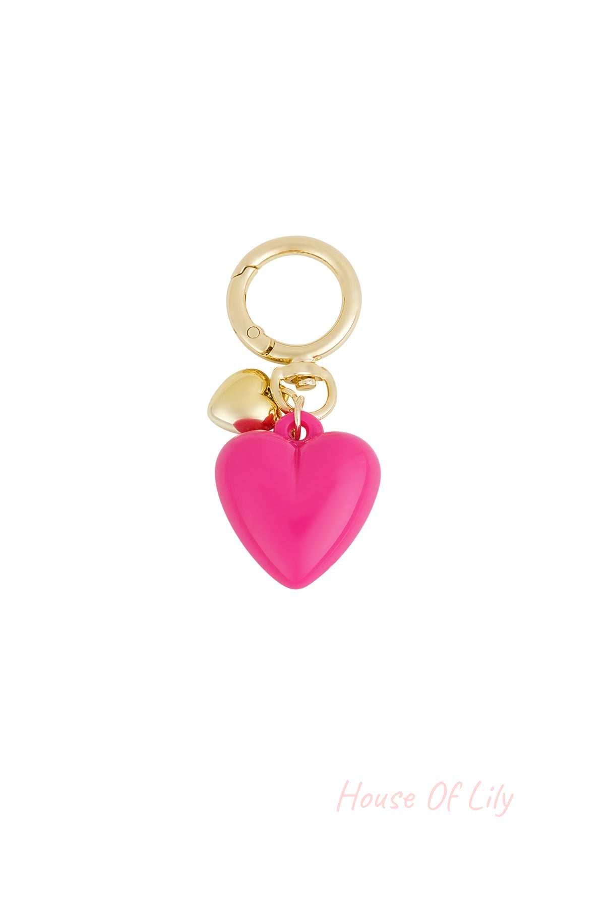 Glossy vibrant pink heart pendant keychain with gold-tone ring and mini heart charm on white background