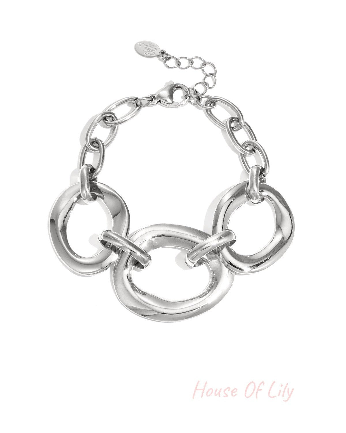 Silver chunky link bracelet with three large irregular oval links and lobster clasp on white background