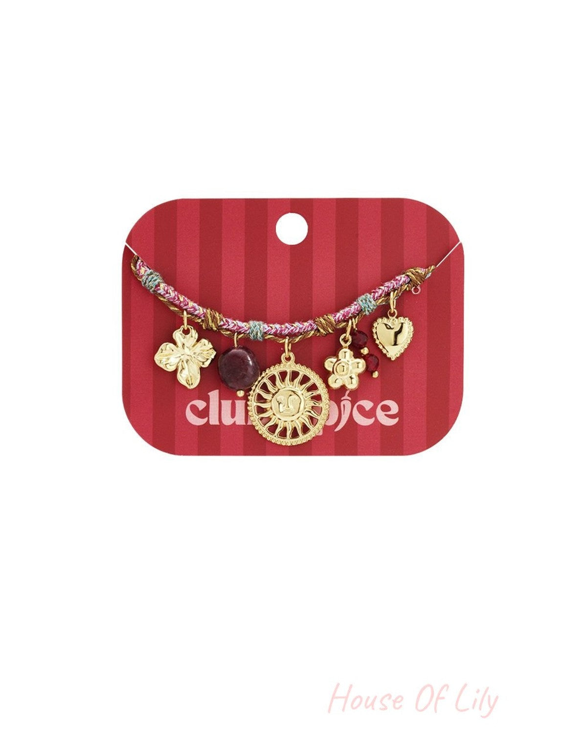 Multi-colored woven charm bracelet featuring gold sun, flower, clover, heart charms, and a dark bead on a red card.