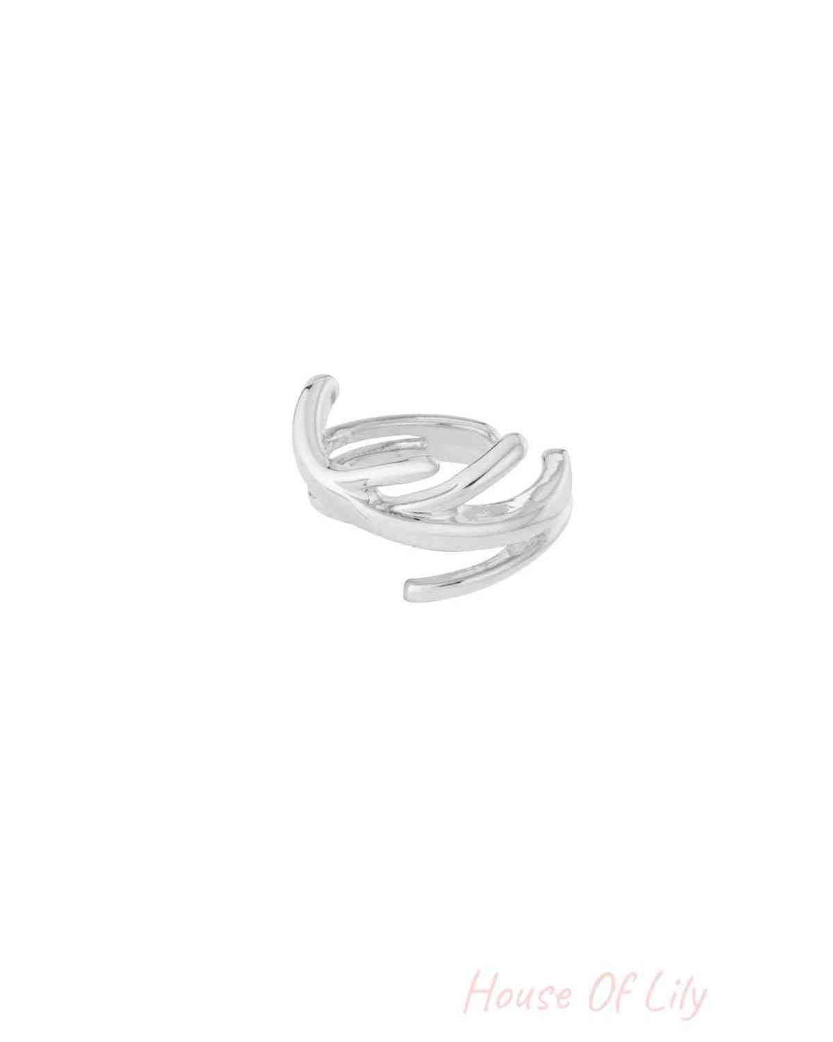 Silver twisted wire ear cuff on white background