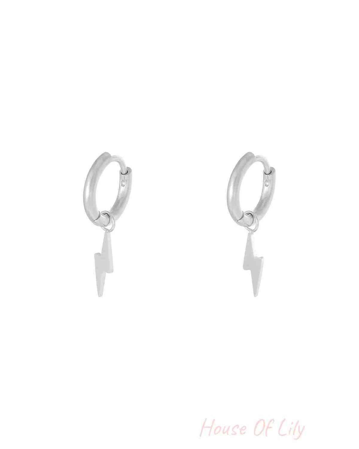 Silver stainless steel hoop earrings with lightning bolt charms on a plain white background
