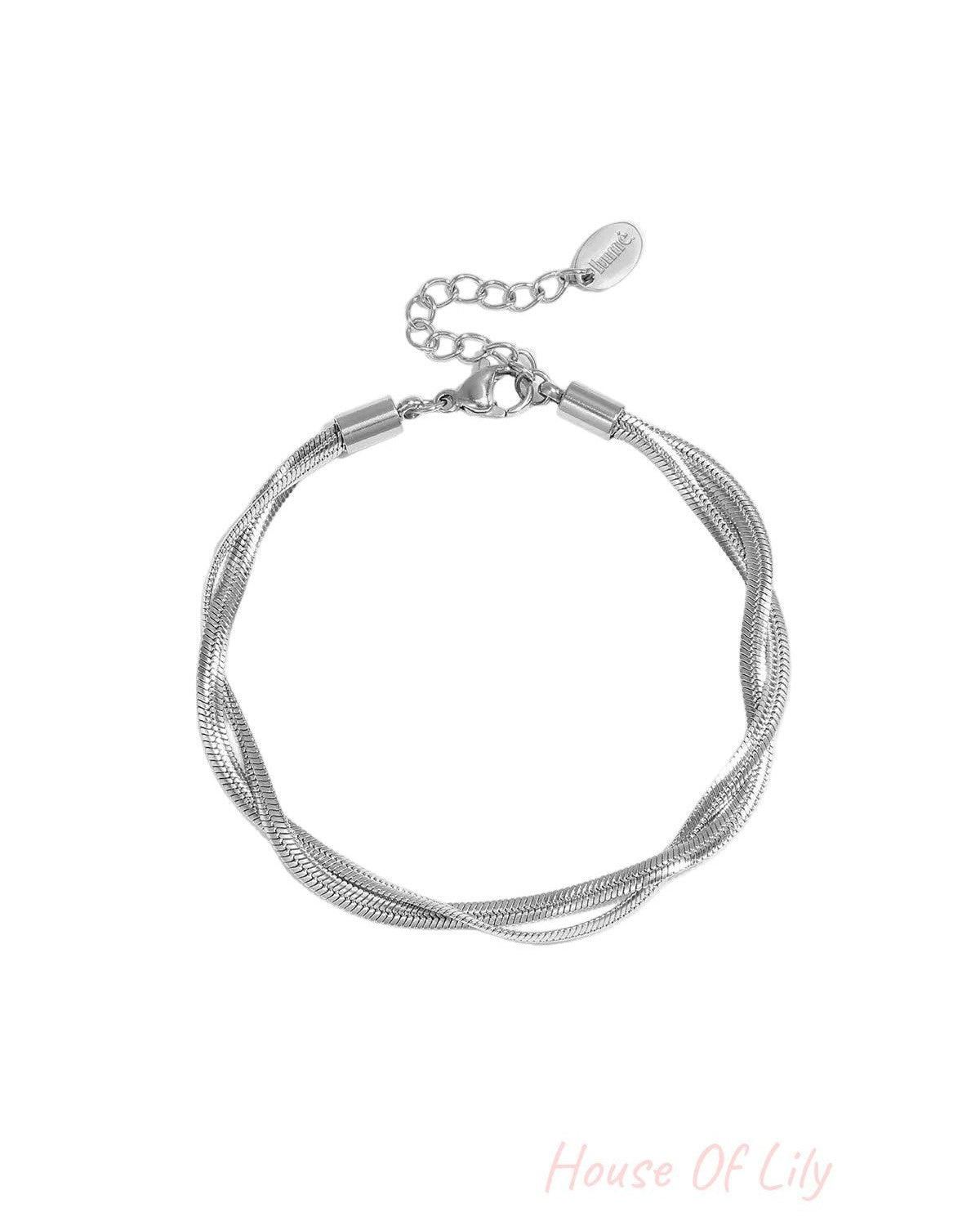 Silver twisted metal chain bracelet with lobster clasp and adjustable extension on white background