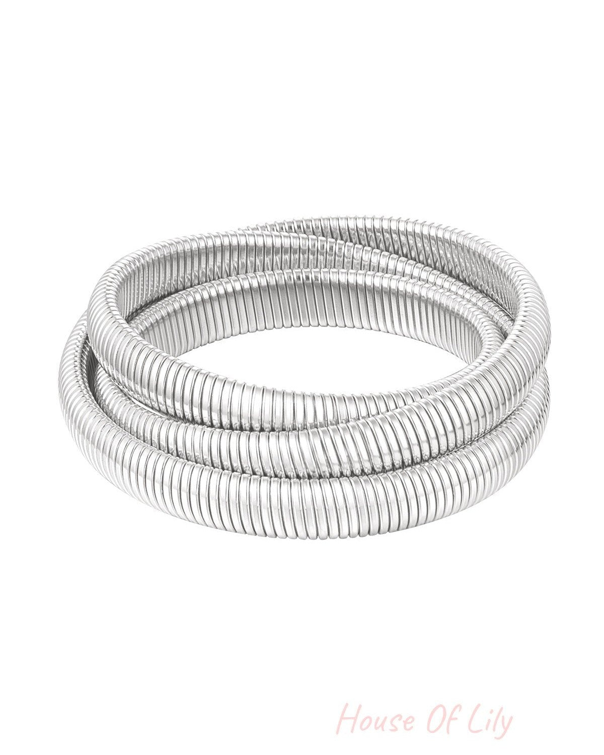 Silver-tone triple coil wrap bracelet with ribbed texture displayed on white background