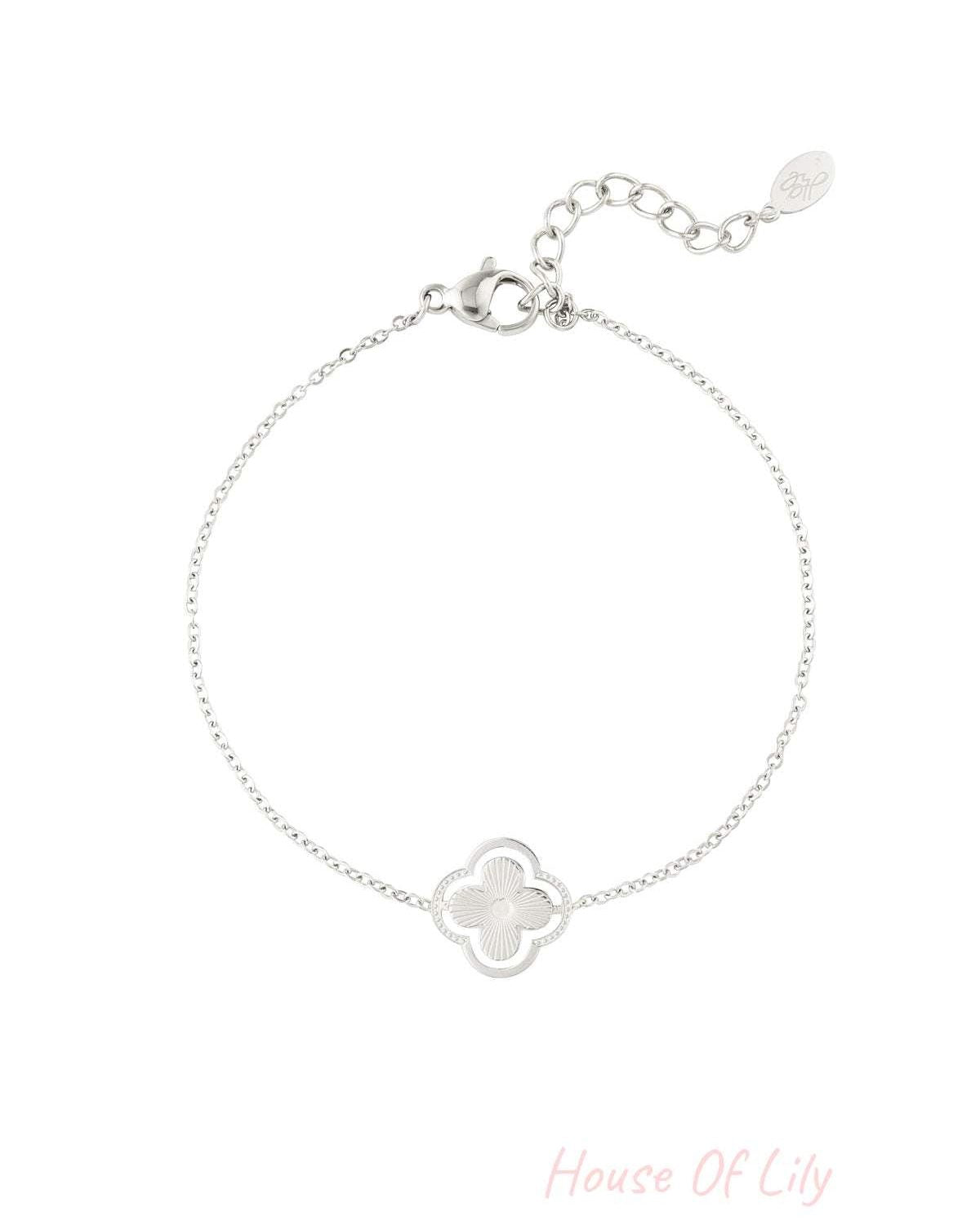 Silver double clover charm bracelet on white background with detailed chain and lobster clasp