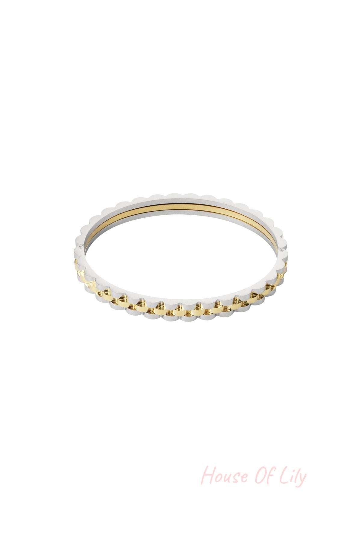 Two-tone scalloped edge bracelet combining silver and gold tones shown isolated on white