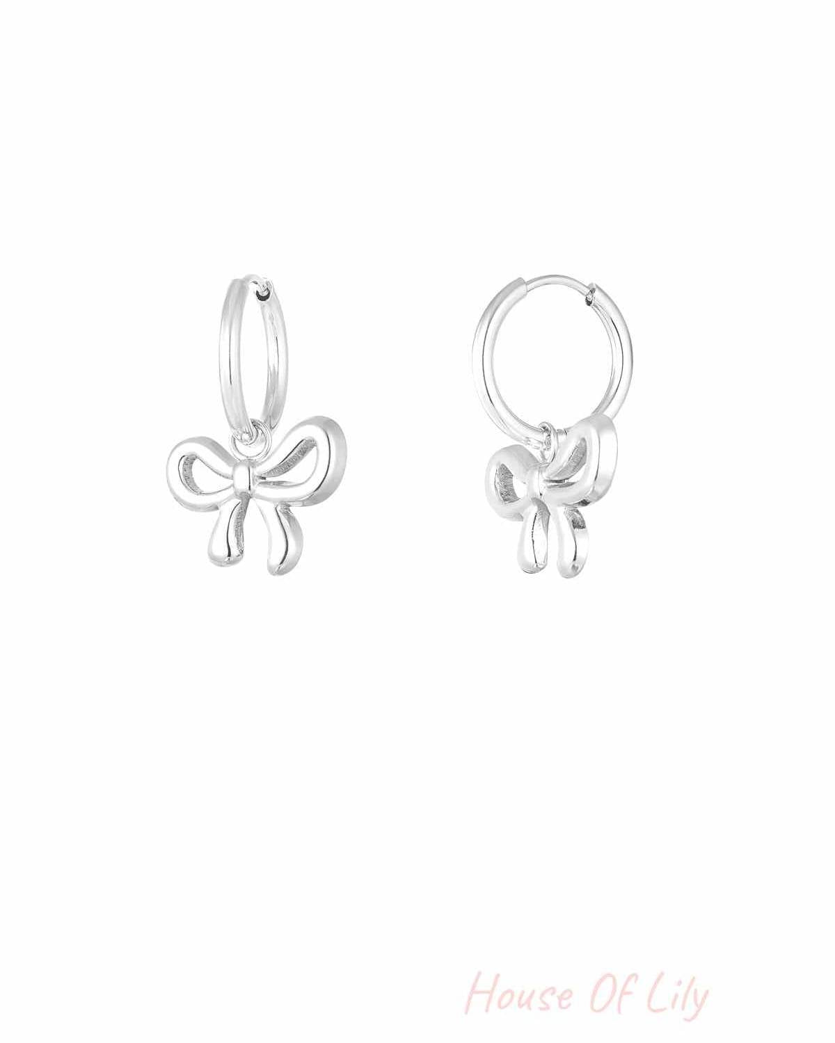 Pair of silver bow hoop earrings with smooth polished finish
