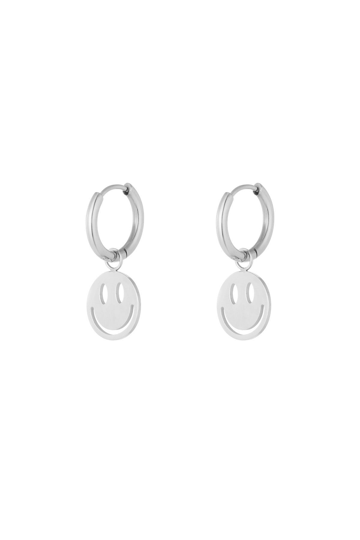 Silver-tone version of the hoop earrings with dangling smiley face charms on a white background