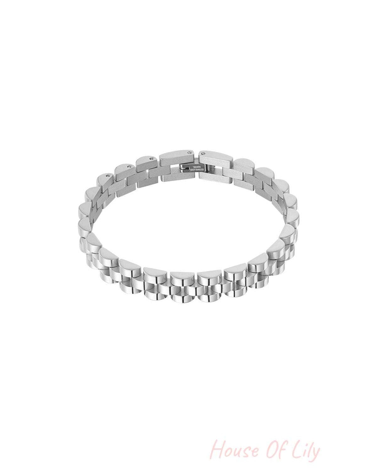 Silver-tone stainless steel chain bracelet close-up, highlighting brushed links