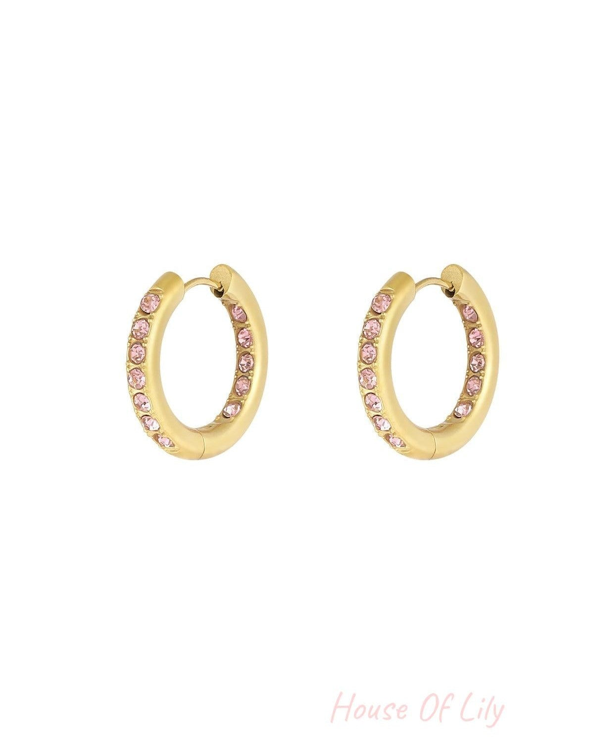 Pair of gold hoop earrings adorned with pink rhinestones on a white background highlighting color variant